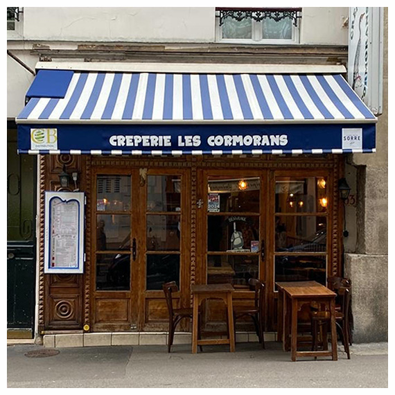 Rentoilage de stores banne crêperie à Paris Le Store Parisien